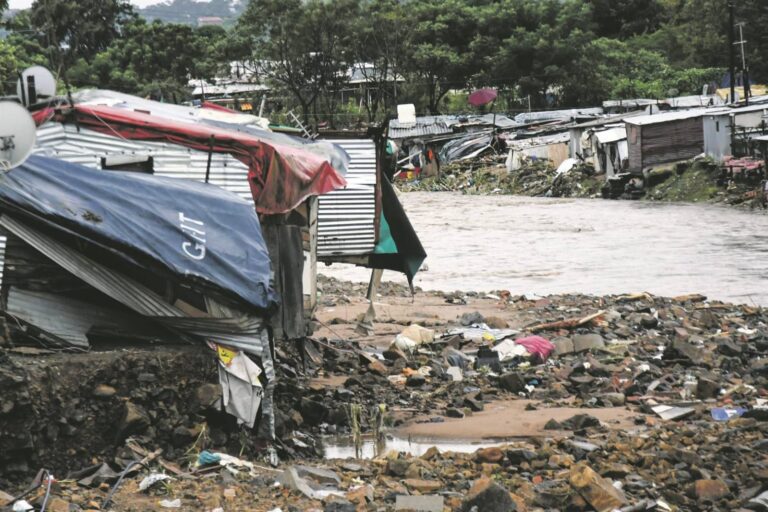 A flooded roadway in KwaZulu-Natal after prolonged heavy rainfall, causing hazardous driving conditions and increasing the risk of accidents. Emergency response teams are working to clear debris and assist affected residents. Image credit: Darren Stewart/ Gallo Images